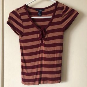 A tight stripped orange and red summer top